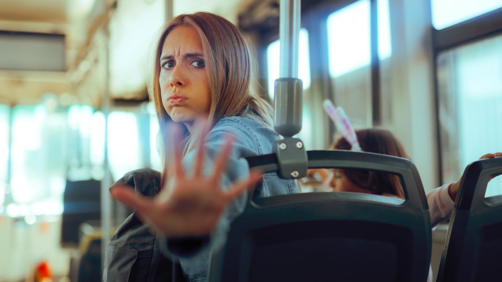 A Pushy Stranger Wouldn’t Leave Her Alone on the Bus—Until She Finally Acknowledged Him woman on a city bus