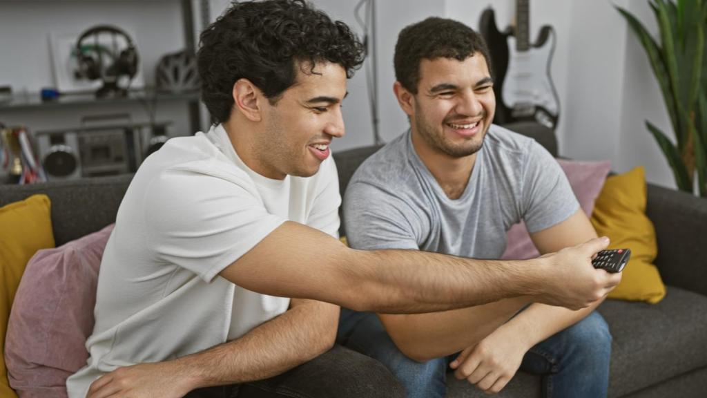 two men on a couch