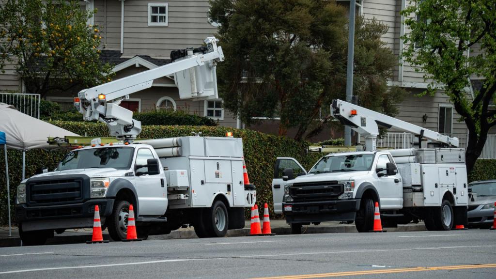 work trucks parked on a street