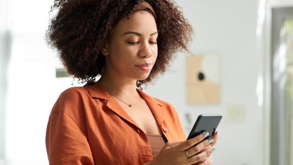 woman looking at her phone
