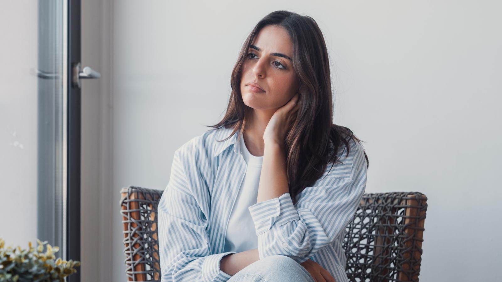 Shes Studying Abroad In Spain, But Her Roommates Wont Stop Belittling Her — And She Cant Move Out woman on a couch