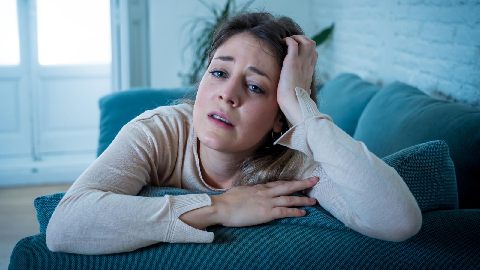 She Quit Two Jobs She Hated—Now She’s Unemployed and Can’t Bring Herself to Apply Anywhere woman on a couch