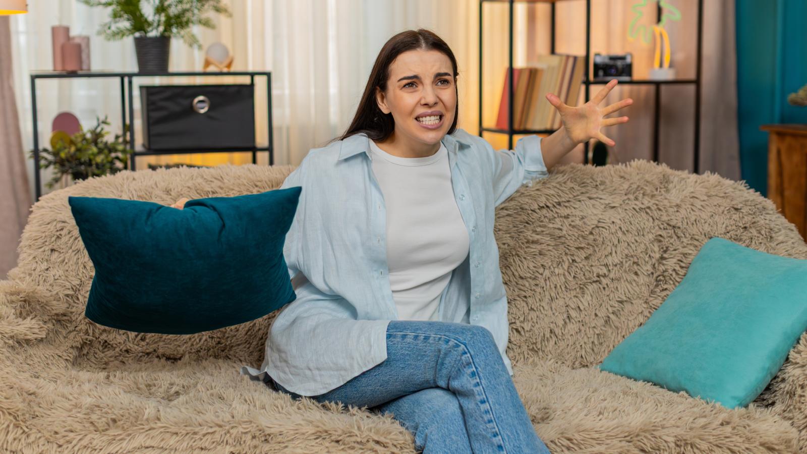 Her Family Wouldnt Stop Asking For Money—Now Shes Putting Herself First woman on a couch