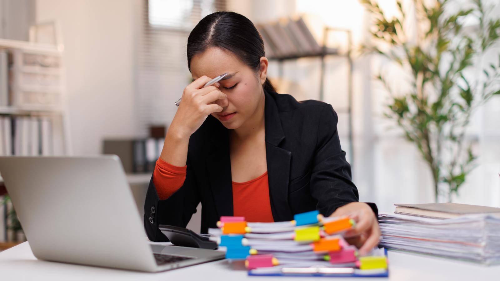 woman stressed out at her desk