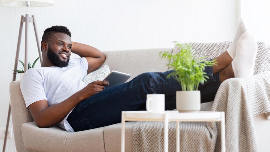 man relaxing on a couch