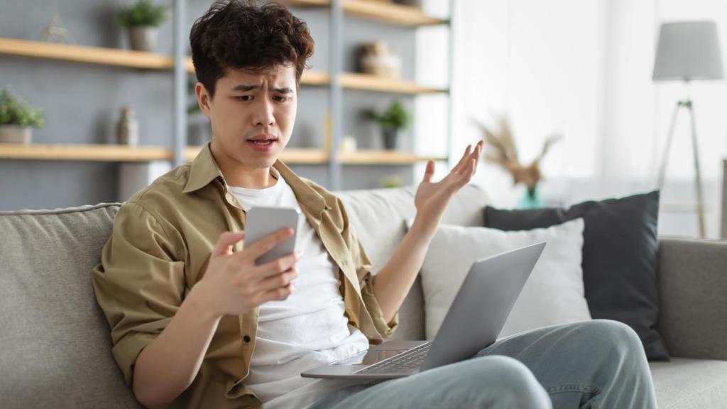 man looking at his phone