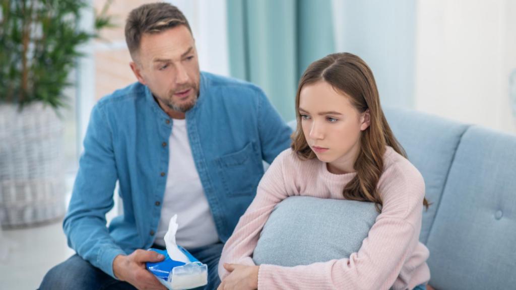 man talking to his daughter