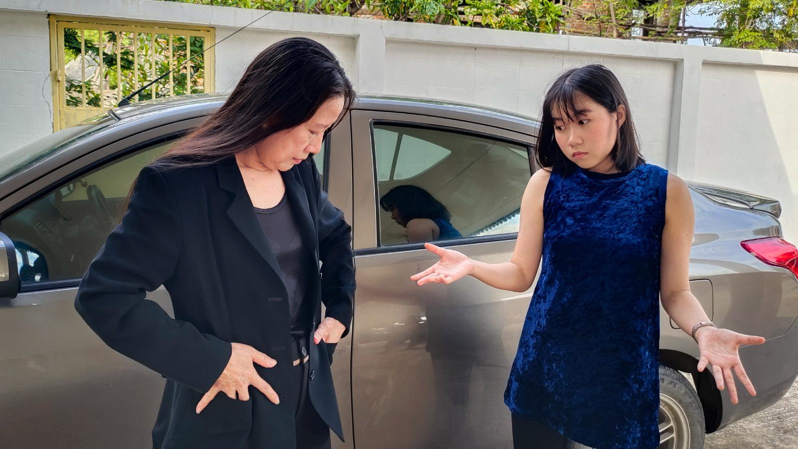 two women in a parking lot