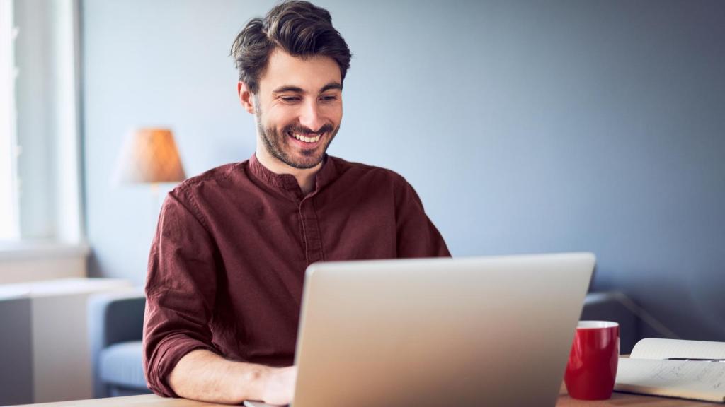 man typing on computer