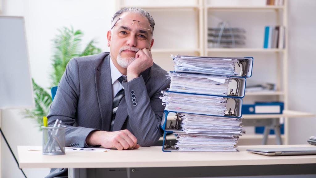 older man at a desk