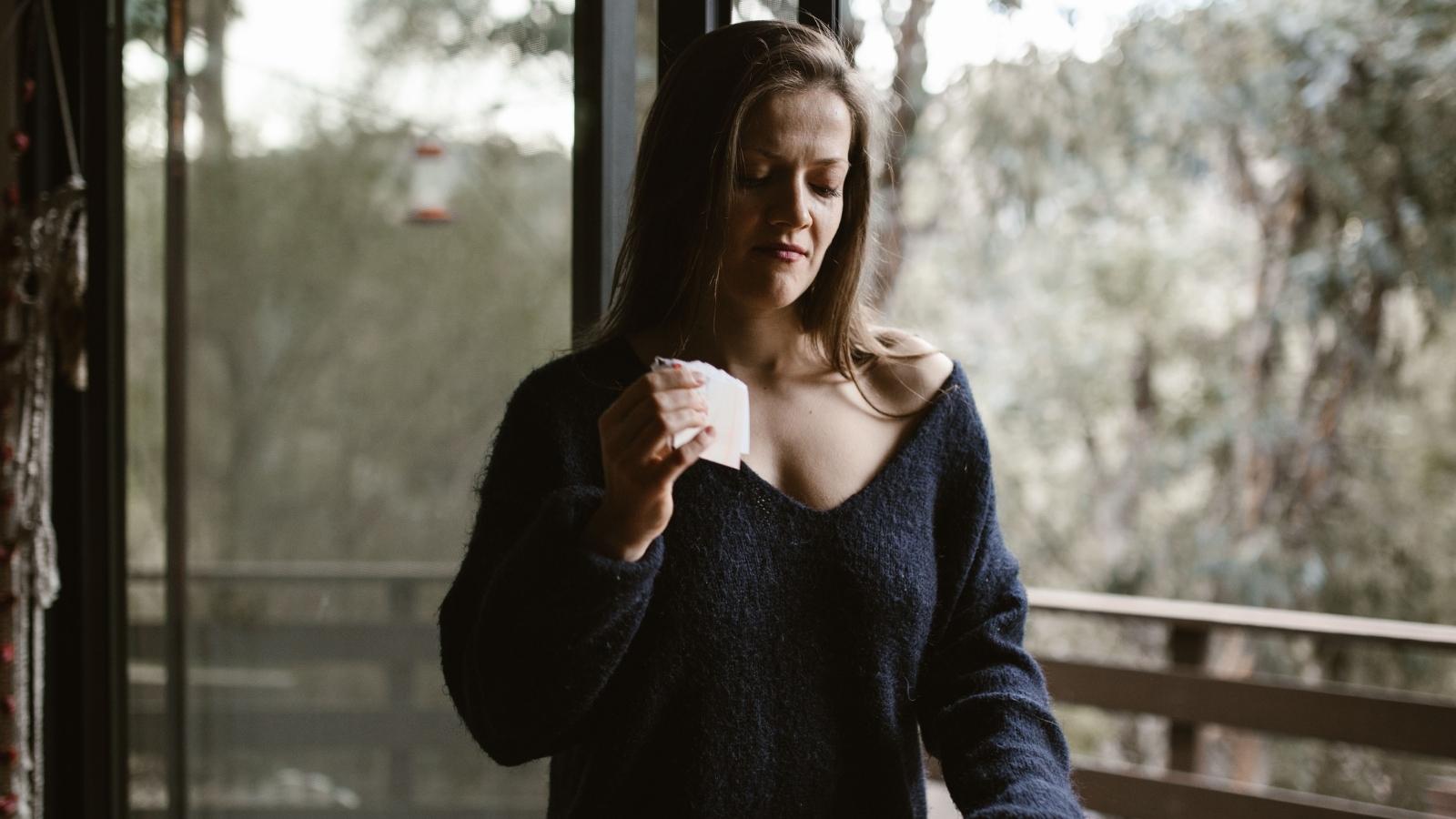 A Bride Refused to Move Her 10 Year Anniversary Wedding Off Her Sibling’s Birthday—Triggering Family Chaos crying woman holding stack of small papers