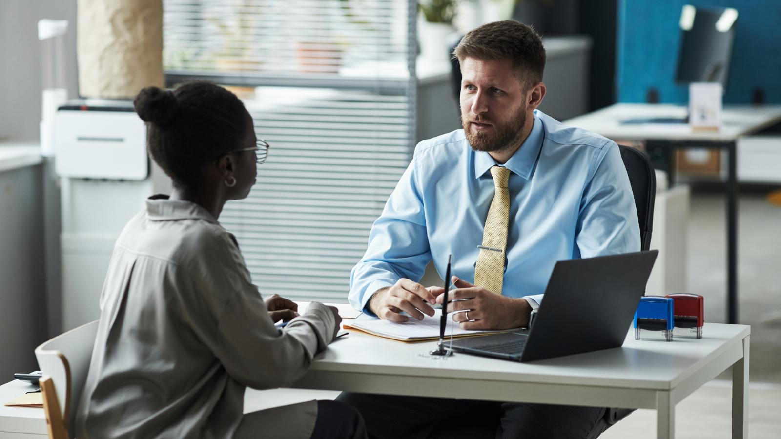 A Customer Gave A Bank Employee A Hard Time Over Her Payout — So He Made Sure She Got Way Less Than She Expected man talking to a customer