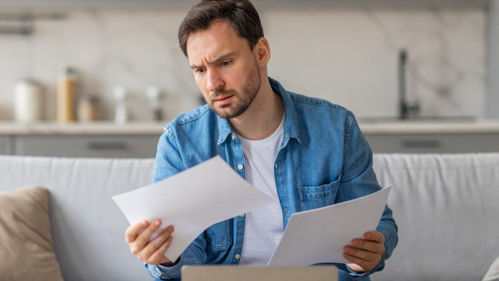 A Neighbor Filed 100+ Pages of Complaints Against His Tenants—So the Landlord Took Action man reading over documents