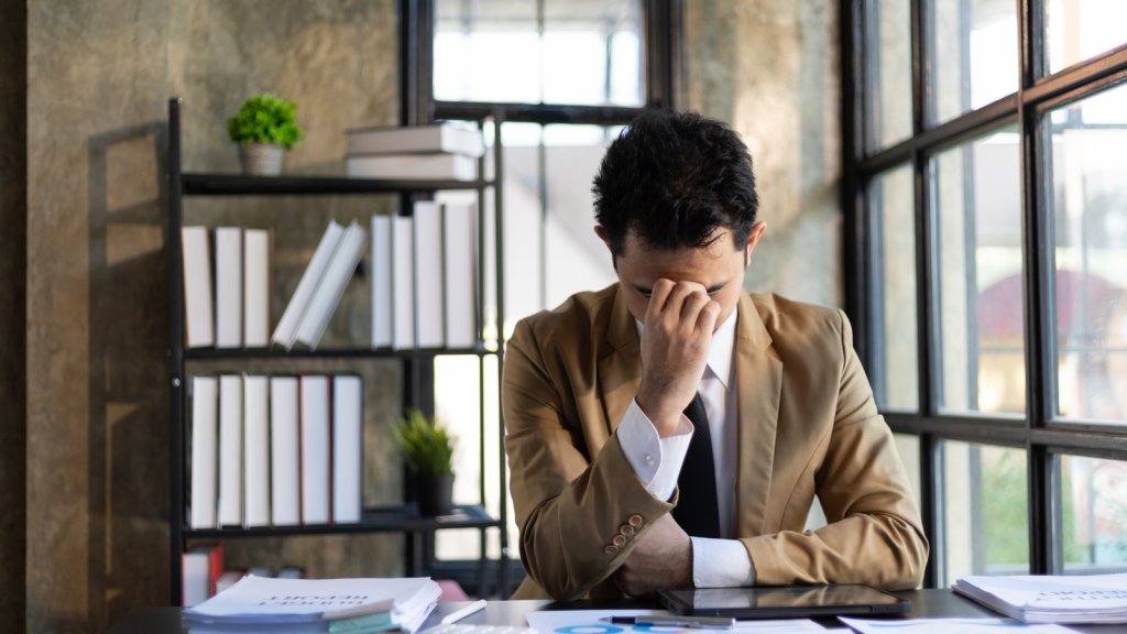 frustrated employee at desk in the office