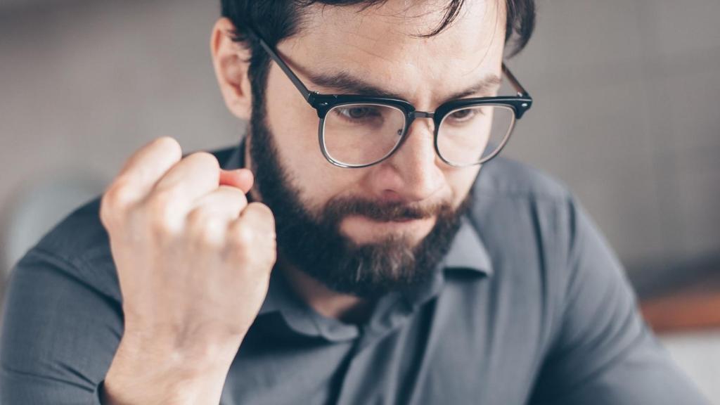 frustrated man putting his fist up