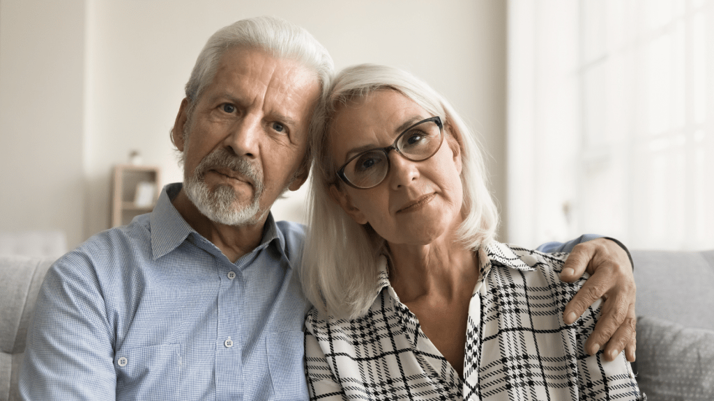 grandparents looking concerned into the camera