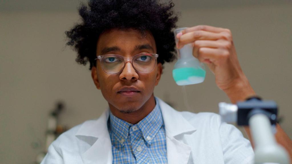 high school science student holding a beaker