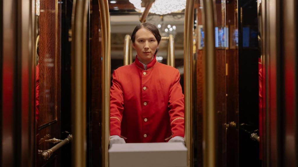 hotel employee in an elevator