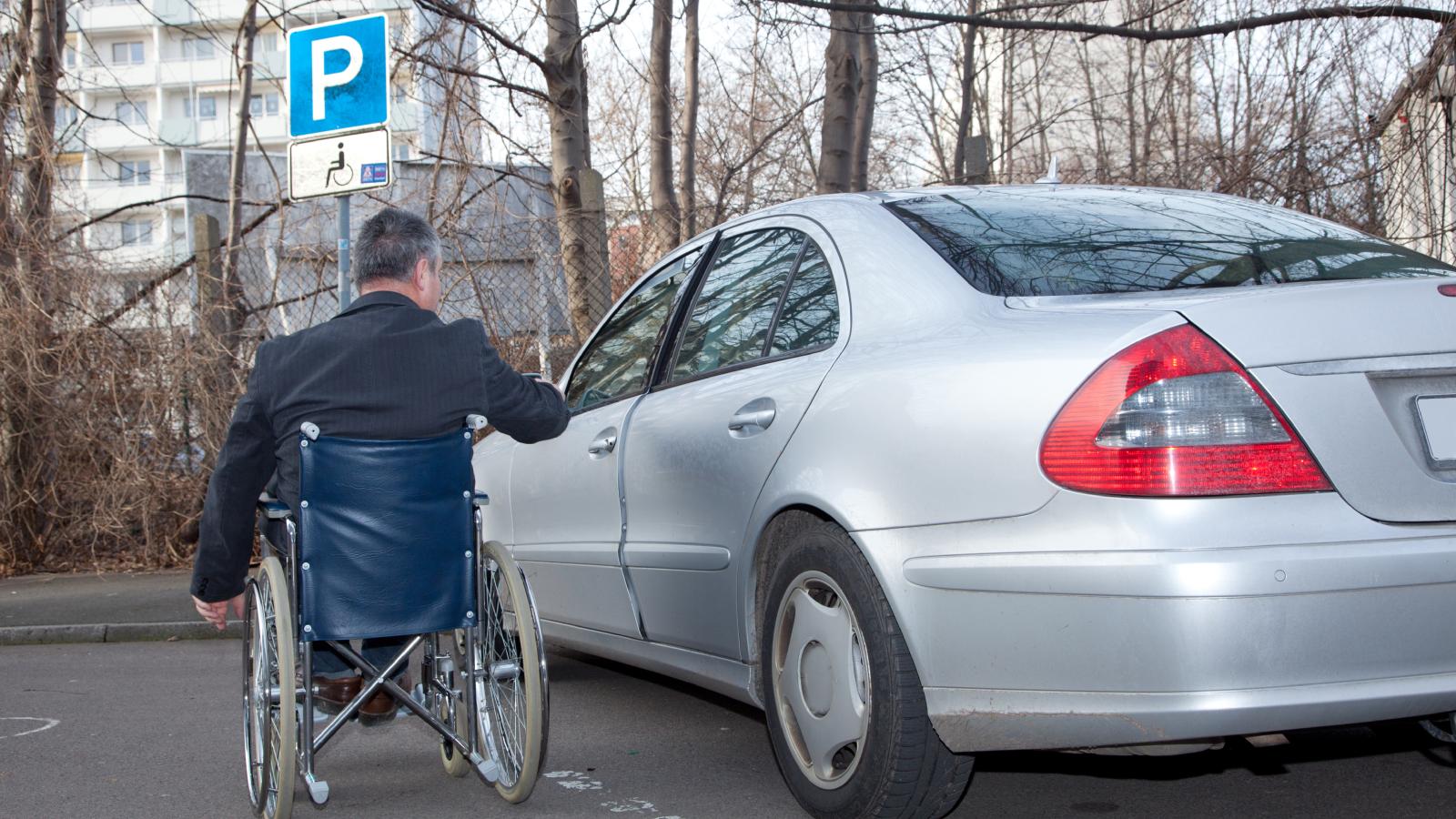 The Staff at His Apartment Complex Keep Parking in His Reserved Disabled Spot—And Hes Reached the Point Where Hes Ready to File a Formal Complaint Over It man in a wheelchair next to a car