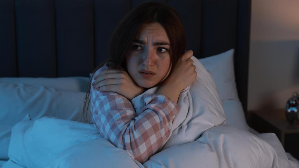 woman scared in her bed