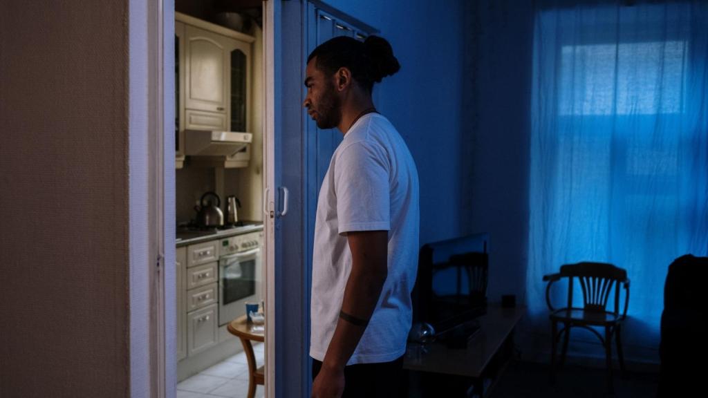 man disassociating in his apartment