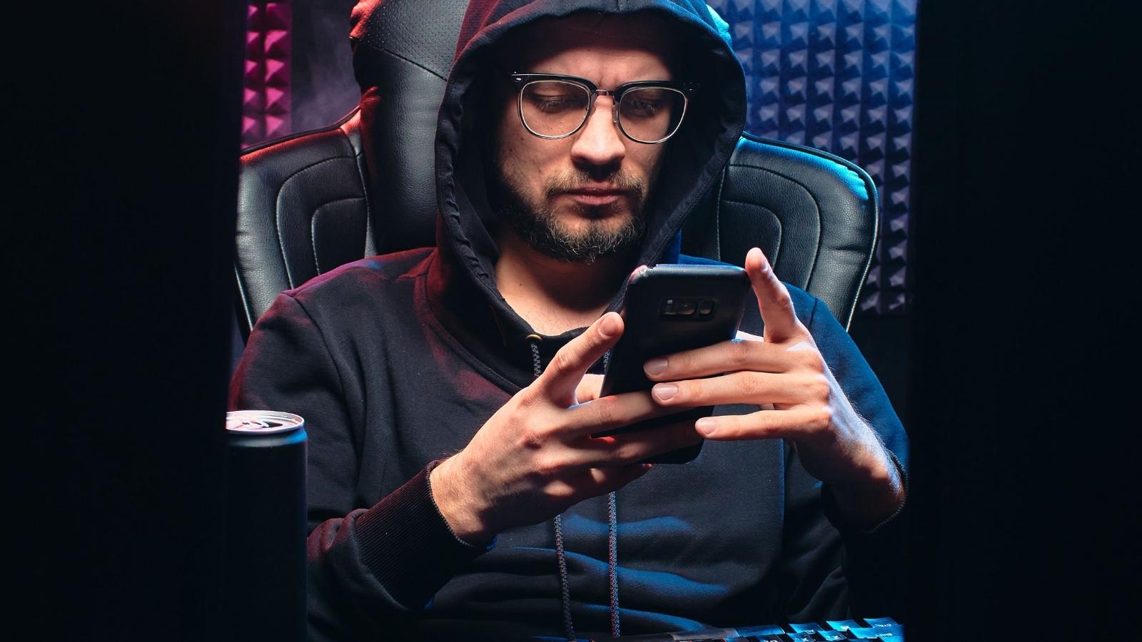 She Quit After Catching Her Boss Secretly Downloading Her Private Search History—Then Deleting the Evidence man in dark hoodie sitting in front of two computer monitors