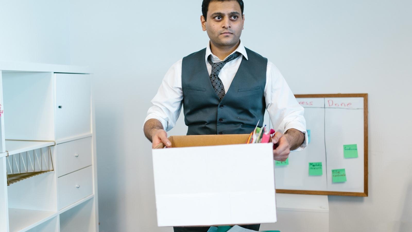 A Worker Handed In His Resignation—So His Boss Immediately Blocked Him and Banished Him From Group Chats man packing up his office