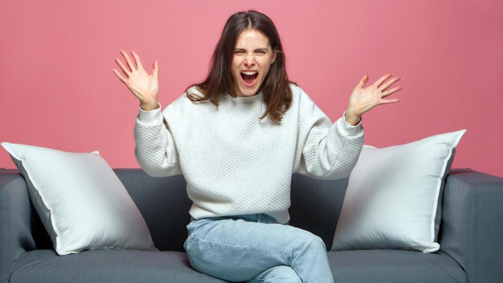 woman yelling on a couch