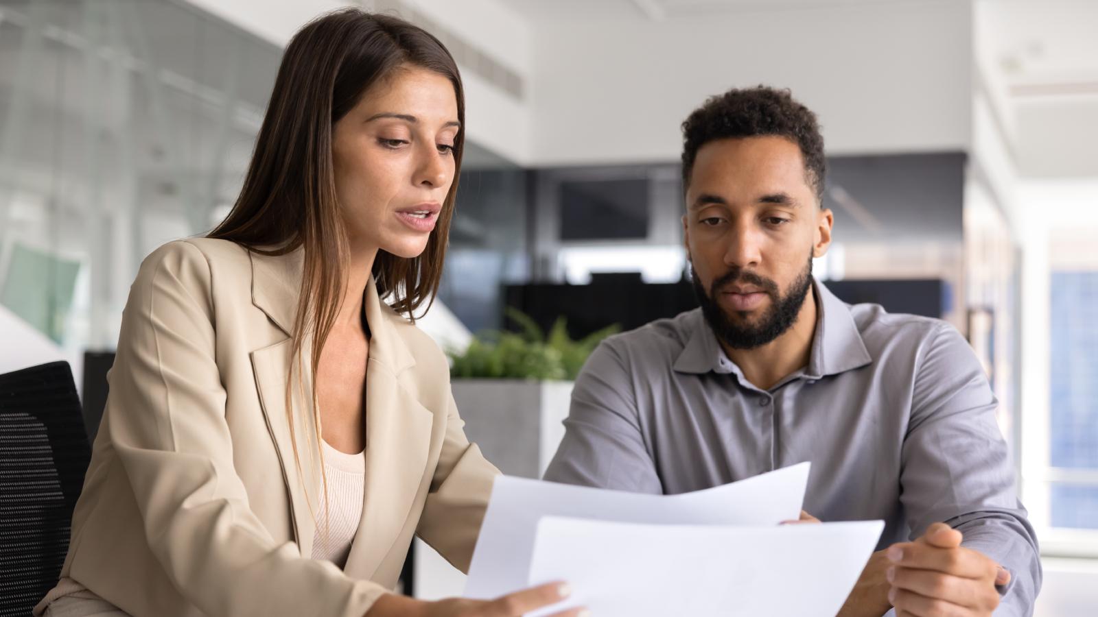 A Client Was Rude to Her at the Tax Office — So She Took Her Time Solving His Problem and Sent Him the Bill for Every Minute woman and man at a meeting