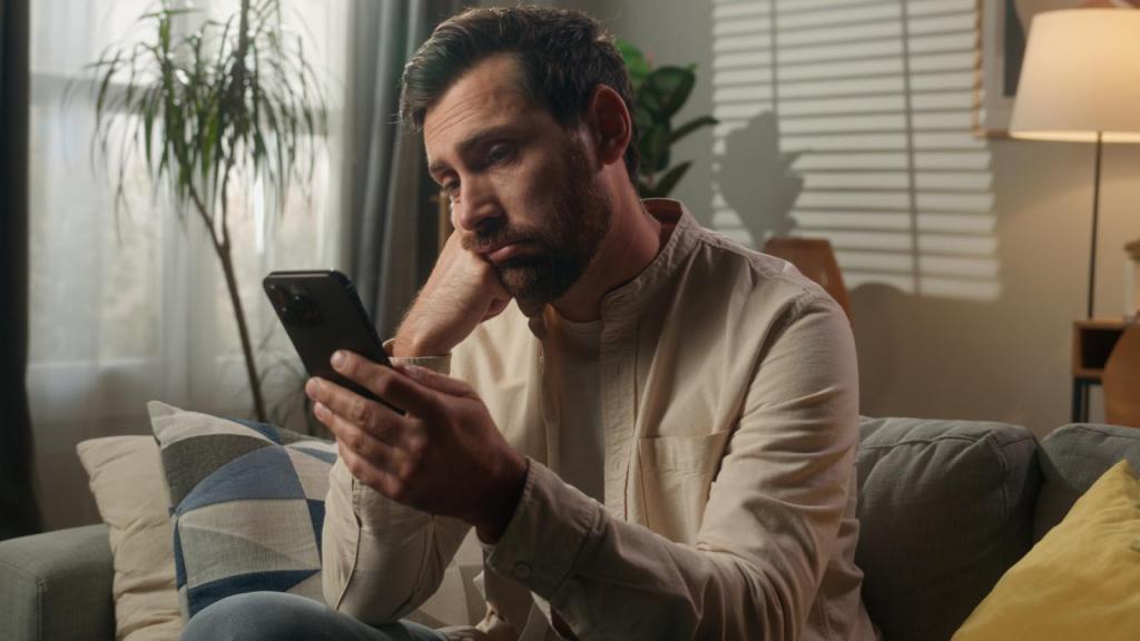 man looking at his phone