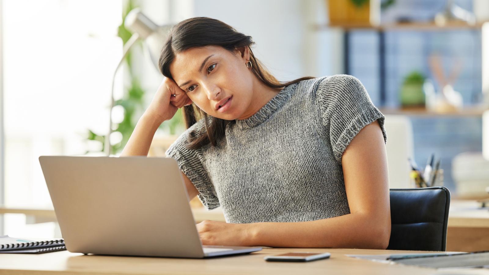 Woman Achieves Her Career Goals but Still Feels Unfulfilled—So What Does She Want to Do Instead? woman looking at her computer