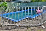Her Neighbors’ Pool Fence Looks Seriously Unsafe—And She’s Terrified Her Young Kids Could Wander In