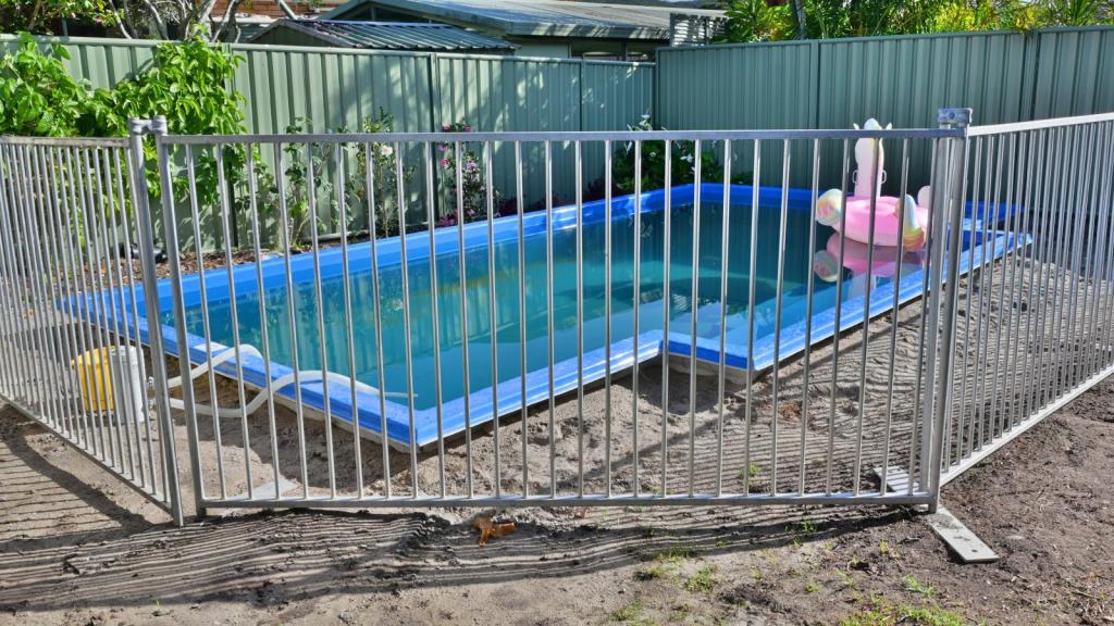 pool with a fence around it