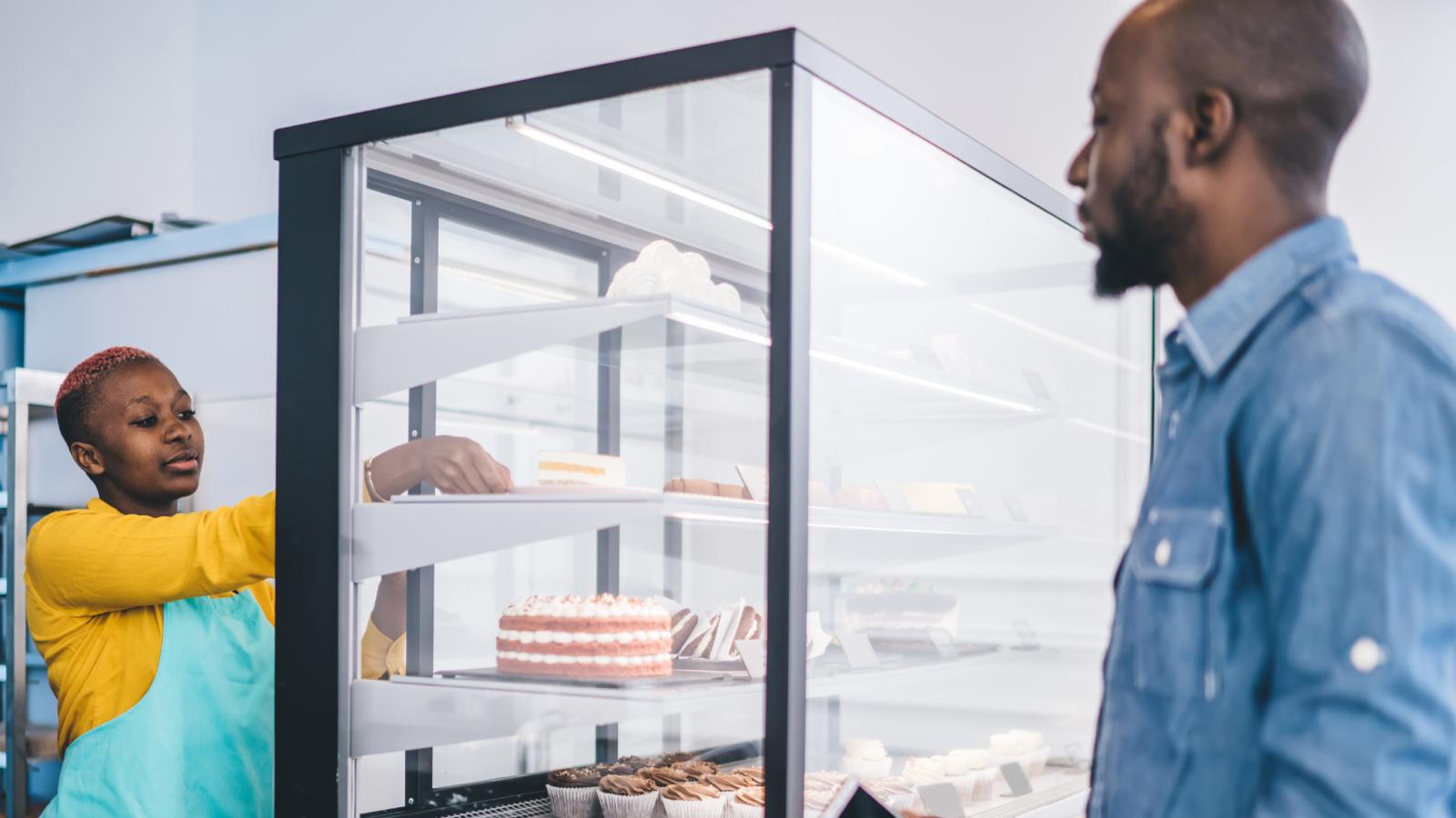 Im Out of Here!: Customer Storms Out of Bakery After Wedding Cake Decorator Refuses Demand woman in a cake store