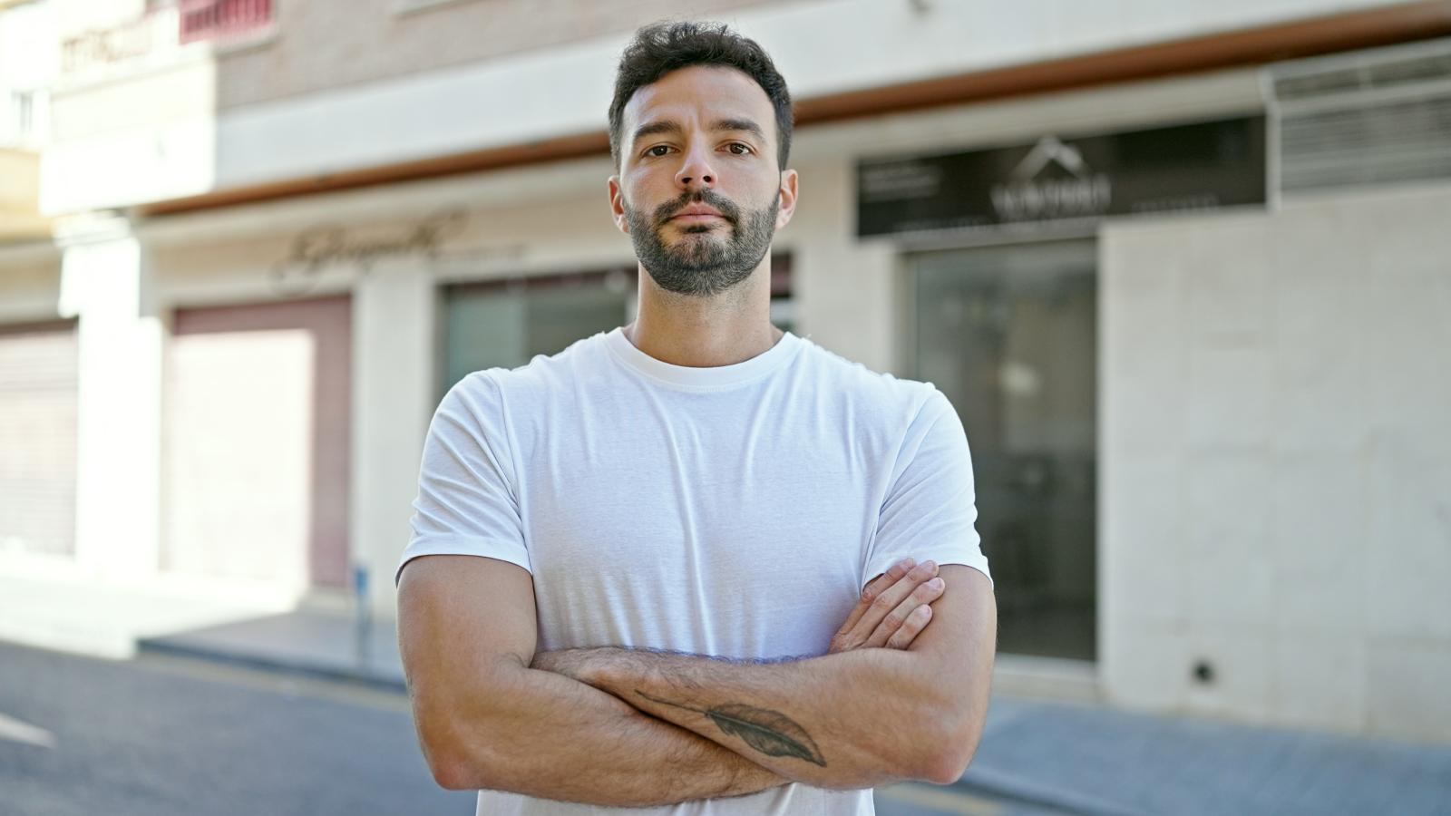 His Neighbors Keep Fighting and Living in Filth—But Now Everyone Around Them Is Affected man with his arms crossed