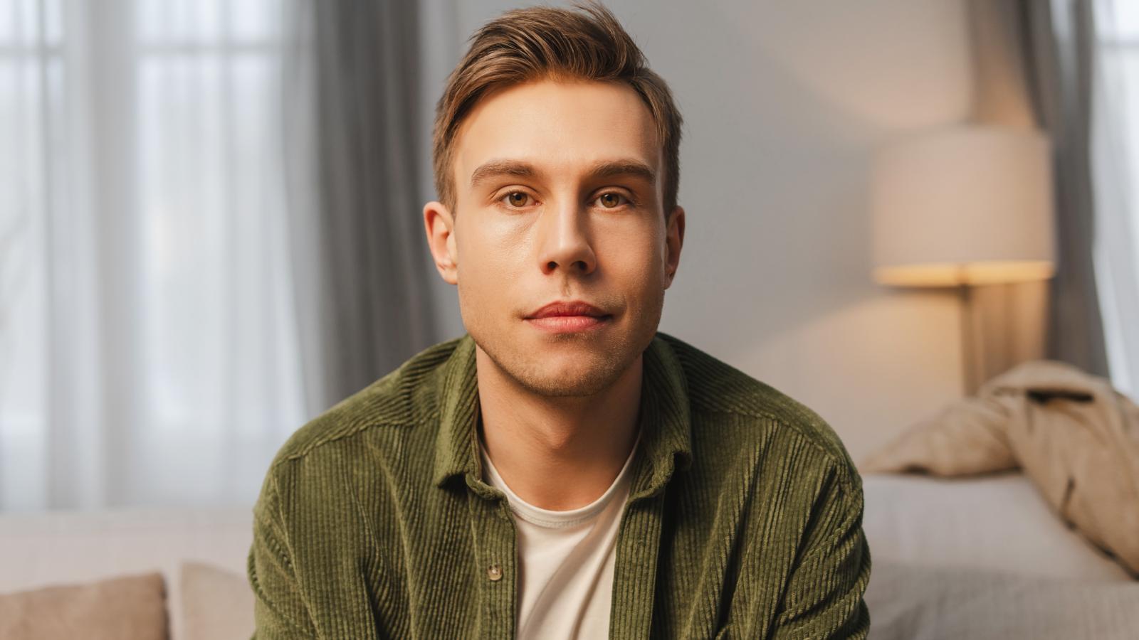 They Agreed the Bigger Bedroom Meant Paying More Rent — Now the Person Getting It Wants Out of the Deal young man with a serious look