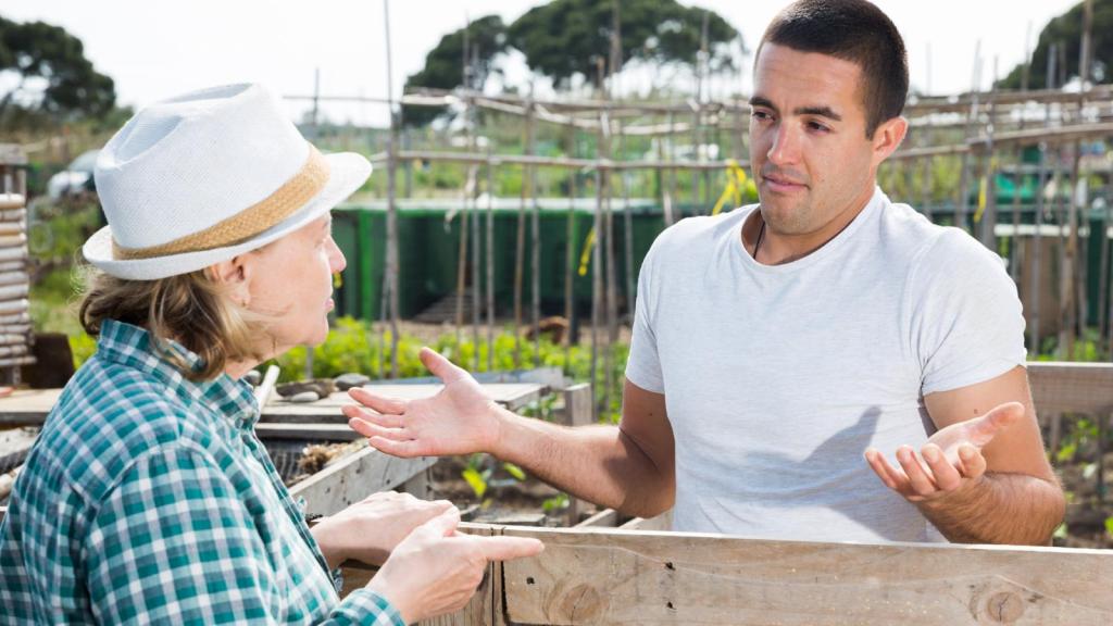 man talking to an older woman