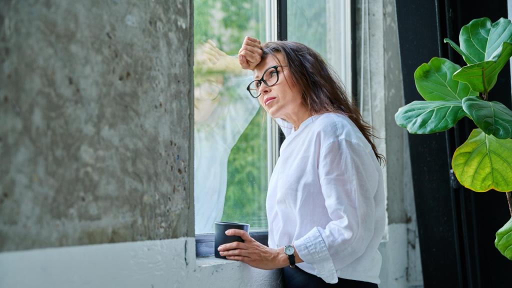 woman looking out a window