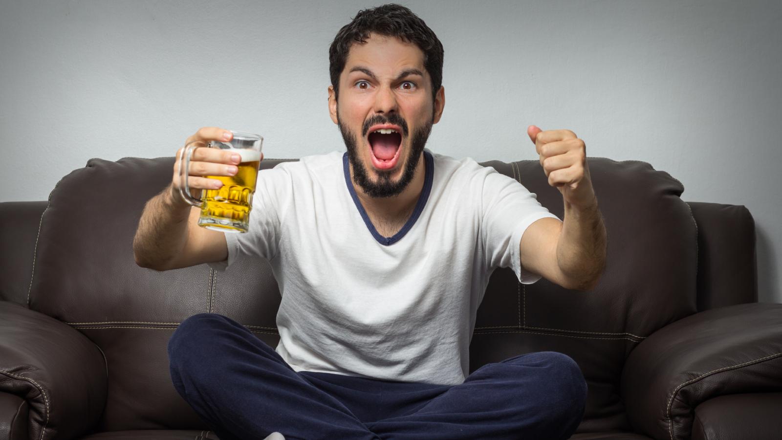 man holding a beer