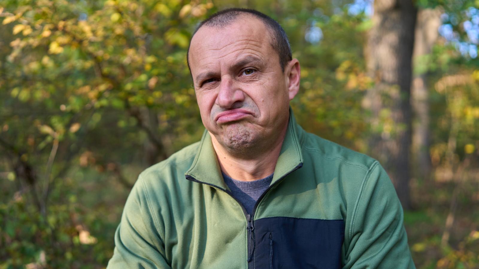 His Neighbors Complain About Everything He Does—Then Refuse to Let a Tree Trimming Truck Park Behind Their House man making a frowning face