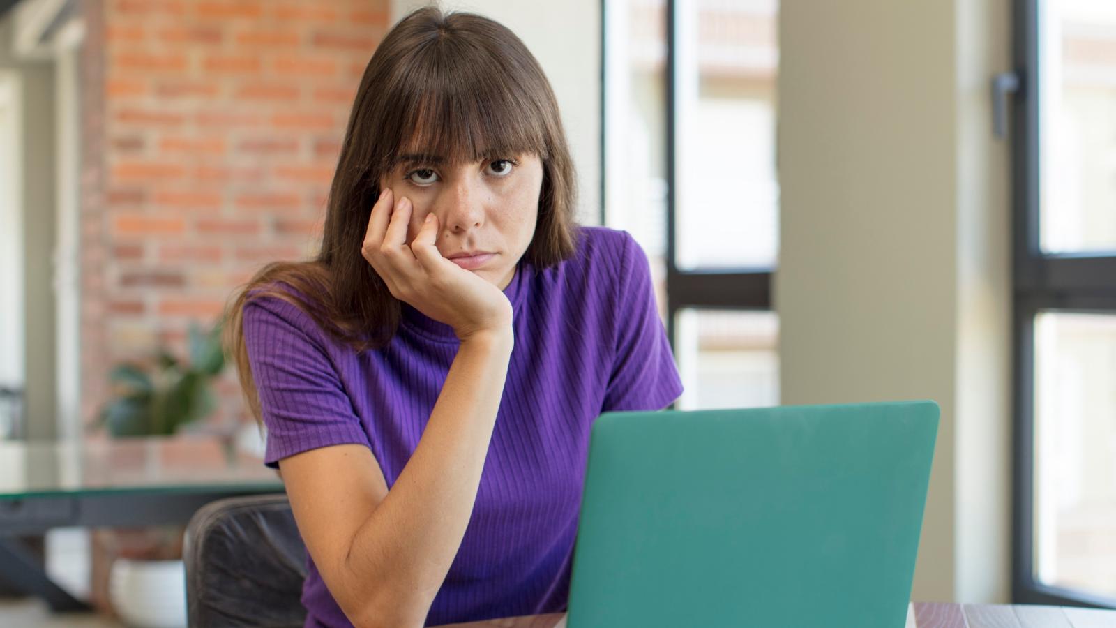 woman bored at her desk