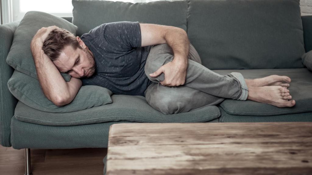 man laying on a couch