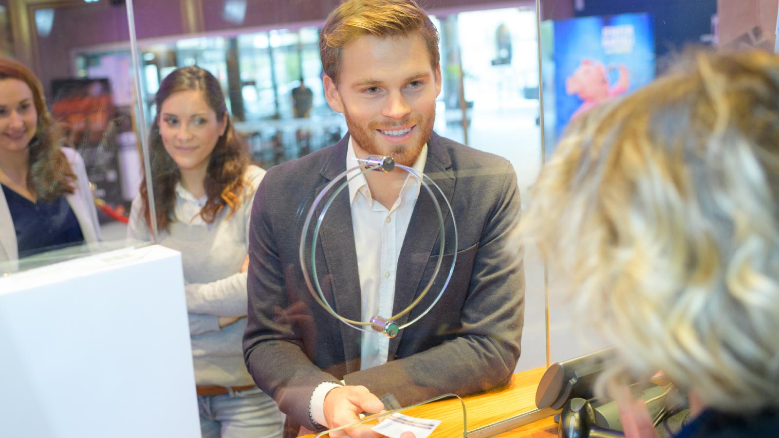 His Bank Said He Could Only Transfer So Much Per Day — So He Closed His Account to Get All the Cash and Immediately Opened a New One man talking to a bank teller