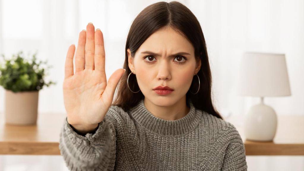 woman holding up her hand