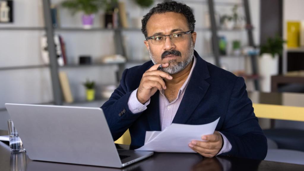 man at his office desk