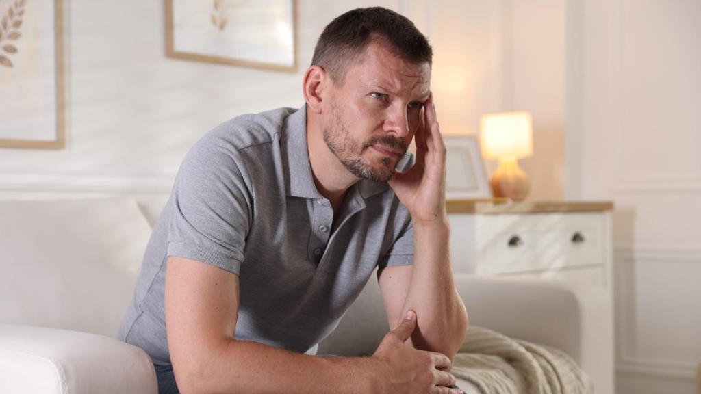 man sittiing on a couch