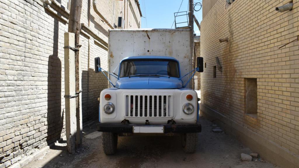 truck parked in an alley
