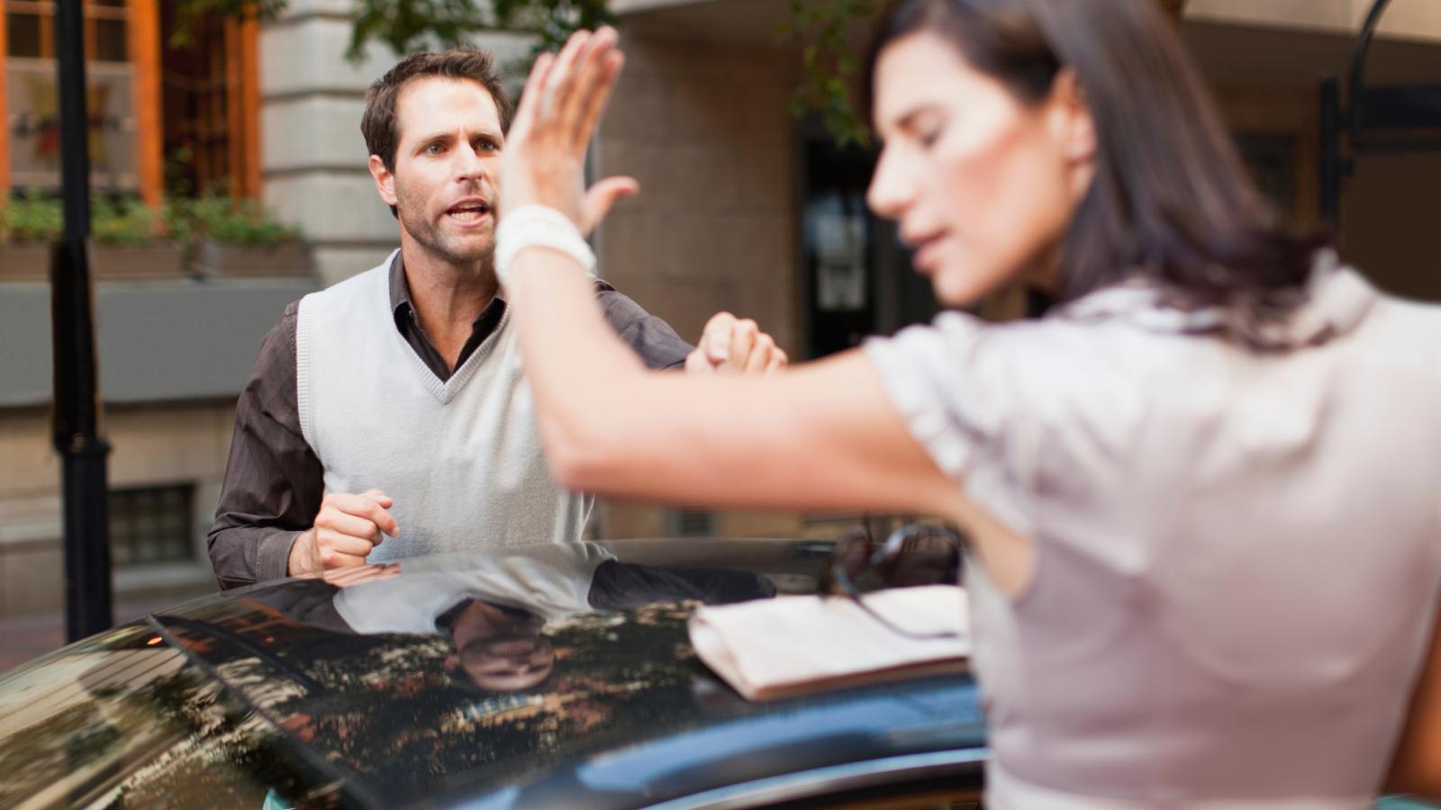 He Found an Open Parking Spot at the Hospital—Then a Woman Confronted Him for Taking It man and woman near a car