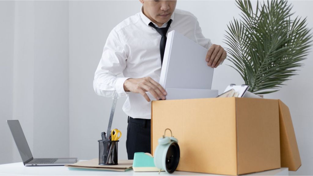 packing up desk at work in box