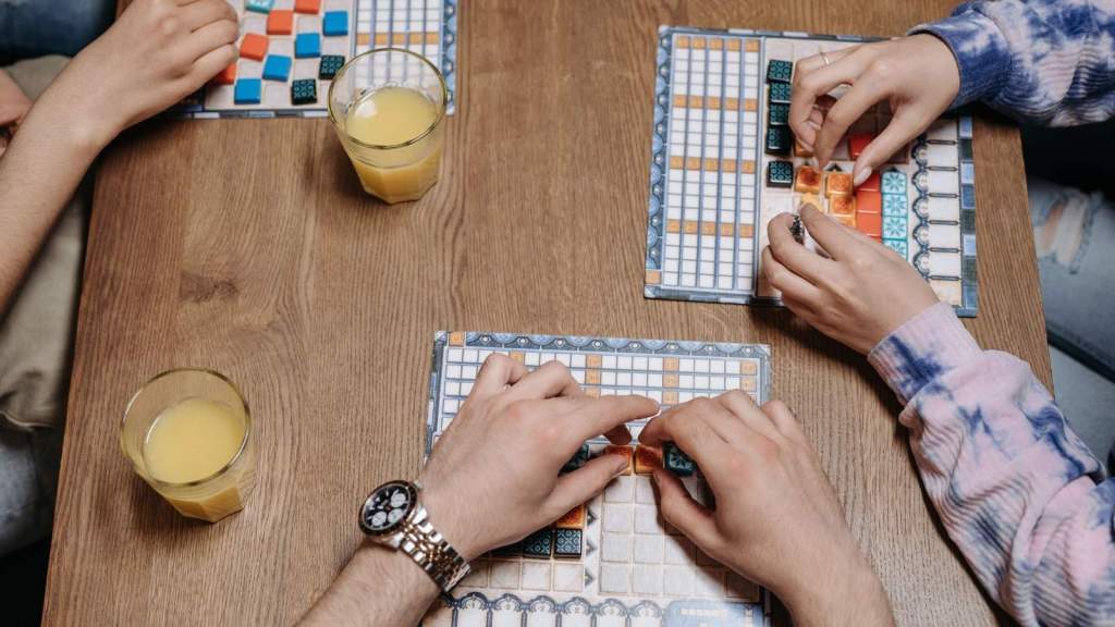 people playing board games